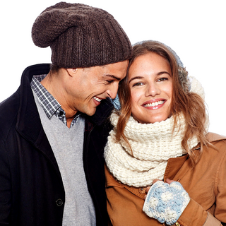 A man and a woman wearing a Double Wide Infinity Scarf.