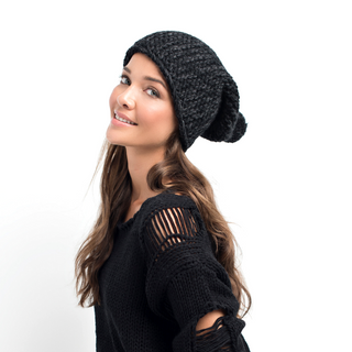 A young woman wearing a Luna Park Slouch beanie.