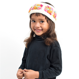 A little girl wearing a Flower Crochet Headband- MULTI's.