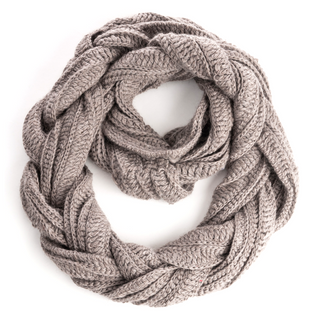 A neatly arranged, handmade in Nepal Braided Infinity Scarf isolated on a white background.