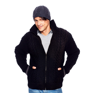 A man wearing a black sweater and beanie, covered with a Cable Jacket w/ Brass Zipper.