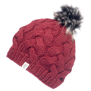 A red Boheme Cable Beanie with Faux Fur Pom.