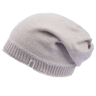 A Dekalb Slouch beanie hat in beige on a white background.