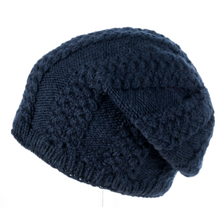 A blue, handmade knitted Cable Floppy Cap on a mannequin.