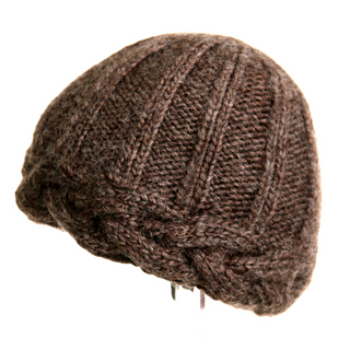 A brown, 100% wool knitted Braided Edge Hat, isolated on a white background.