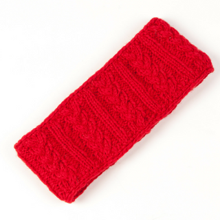 A red wool Cable Headband with a braid cable design on a white background, handmade in Nepal.