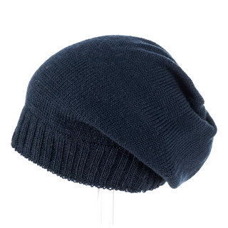 A handmade Big Rib Band Slouch m knit hat in black merino wool on a white background.