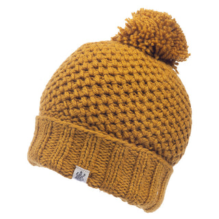 A Rutland Beanie, handmade in merino wool with a pom pom.