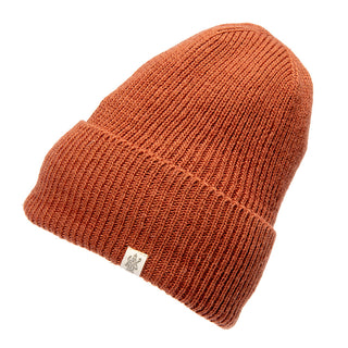 A Troubadour Rib Fold Beanie, knit from Merino Wool with a white logo.