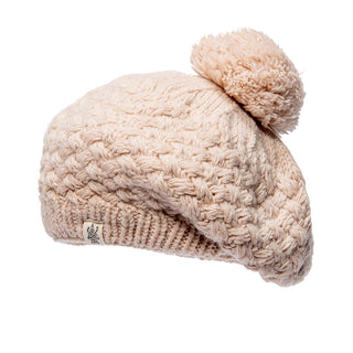 A Bliss Beret with a pom pom on it.