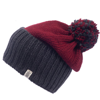 A Masha pom slouch beanie with a black pom pom.