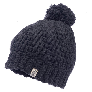 A black merino wool Swirl pom beanie.