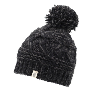 A black beanie hat with a reverse cross pom pom.