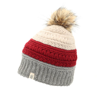 A beanie hat with a Stripe flower fur pom pom.