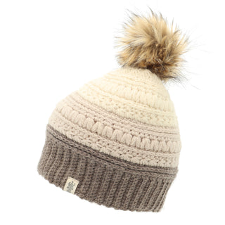 A women's beanie with a Stripe flower fur pom pom.