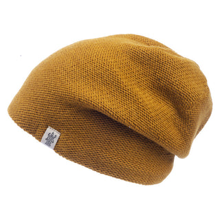 A Depp Slouch beanie on a white background, perfect for skincare enthusiasts.