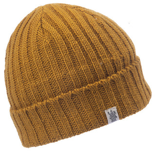 The Clyde Rib Fold Cap in mustard with a ribbed knit pattern.