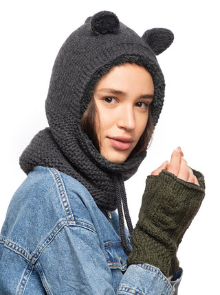A woman wearing a handmade Teddy Hood and gloves.