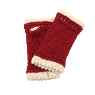 A pair of Les handwarmers in red and cream on a white background.