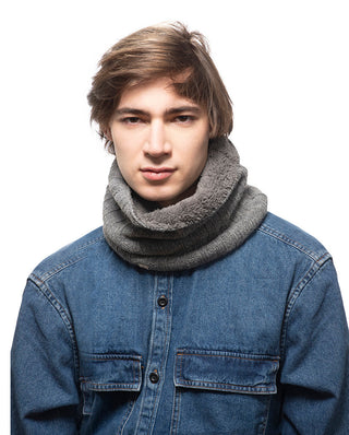A young man in a denim jacket wearing Ribbed Neckwarmers.