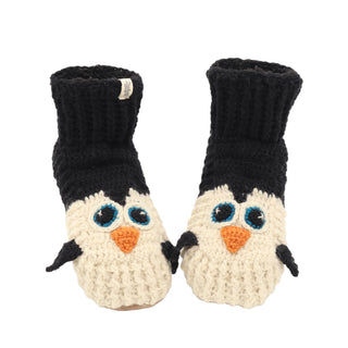 A pair of black and white crocheted Penguin slippers.