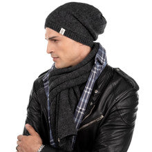 A man in a leather jacket, adorned with a Merino Wool scarf and wearing a Dekalb Slouch hat.