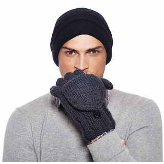 A man wearing a Stripe Tube Slouch hat and mittens.