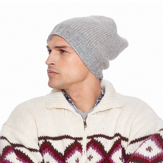 A man wearing a Big Rib Band Slouch m sweater and beanie.
