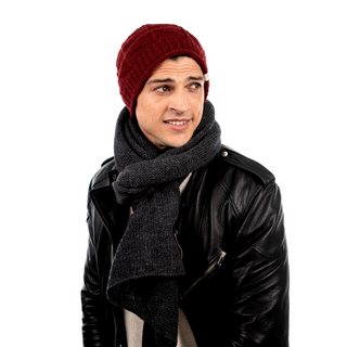 A man in an eco-friendly Wave Slouch leather jacket wearing a beanie and scarf.