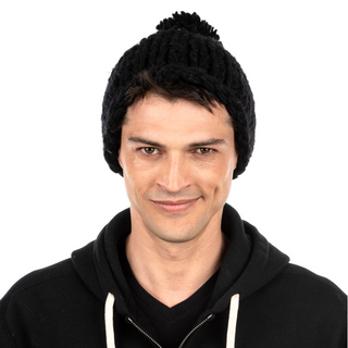 A man wearing a black wool sweater and Chunky Beanie w/ Pom.