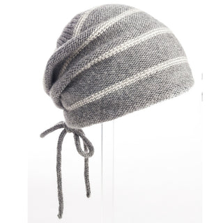 A handmade Stripe Pouch Slouch Hat on a mannequin.