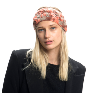 A woman wearing a Flower Crochet Headband- MULTI's as part of her winter ensemble.