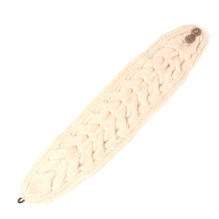 Handmade in Nepal, Soho Headband with Elastic Button Closure made of cream-colored wool with a cable pattern, displayed against a white background.