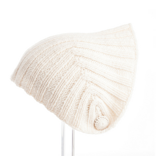 A Vermeer Scarf, handmade in Nepal, with a ribbed design and a pompom, displayed on a plain white background.