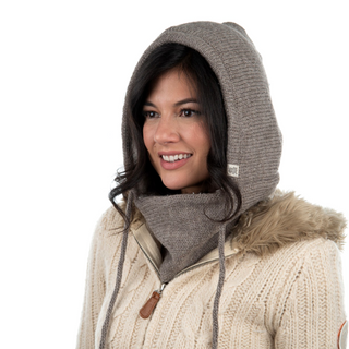A woman wearing a Hero Hood and Sherpa Fleece hat.