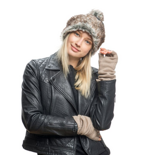 A woman wearing a leather jacket and Long Legacy Handwarmers.