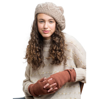 A young woman wearing a tan Merino Wool sweater and Long Legacy Handwarmers.
