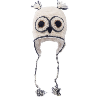 A Crochet Owl Hat with an owl face design, featuring large round eyes and tassels on top and at the end of ear flaps.