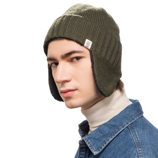 A young man wearing a Rib Band Earflap beanie, perfect for enhancing SEO in product descriptions.