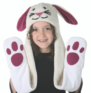 A young girl wearing a wool Bunny Hatscarf from Nepal with paws on it.