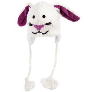 A hand-made Bunny Hat knitted from Merino Wool, featuring rabbit ear designs and dangling pom-pom ties on a white background.