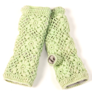 Stay cozy in style with the Flower Crochet Handwarmers—light green wool fingerless gloves for women, featuring a floral crochet pattern and a thumb opening.