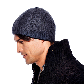 A man in profile wearing a gray Oxford Beanie and a black knit sweater, both handmade in Nepal with 100% wool and fleece lining.