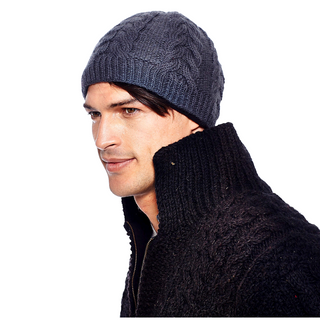 Profile view of a man wearing a Oxford Beanie with fleece lining and a dark textured sweater.