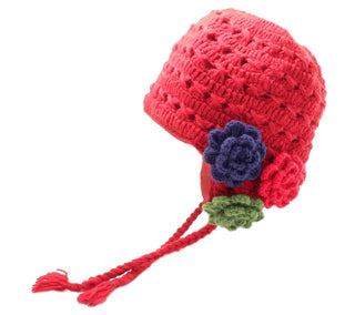 A red Crochet 3 Flower Earflap baby hat with a decorative flower and a tassel, handmade in Nepal from wool, isolated on a white background.