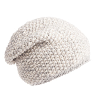 A handmade white knitted beanie with a Marich Pattern Long Pull On Cap on a white background.
