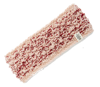 A pink and red Aurora Headband, knitted from merino wool, on a white background.