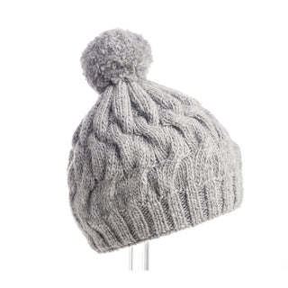 Dante Beanie with Pom made from merino wool, featuring a fleece band lining, on a white background.