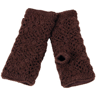 The Flower Crochet Handwarmers are brown, fingerless gloves with a floral pattern and thumb hole. Laid flat, the pair overlaps slightly.