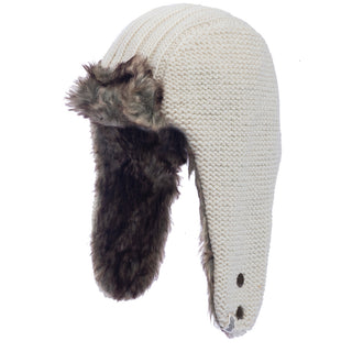 A white Winter trapper hat with a faux fur lining.